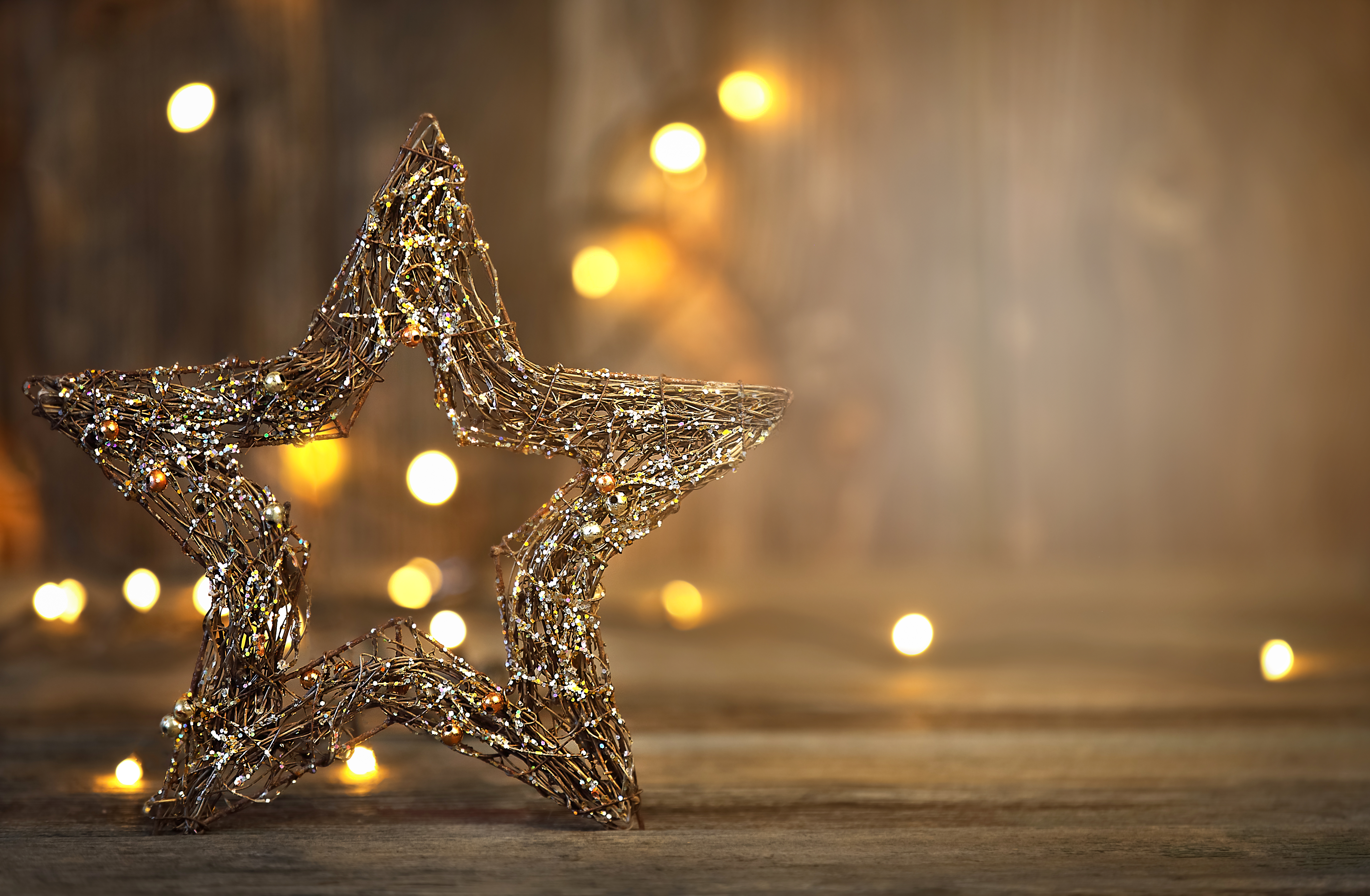 Christmas star with lghts on a wooden background